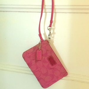 A small coach wristlet.